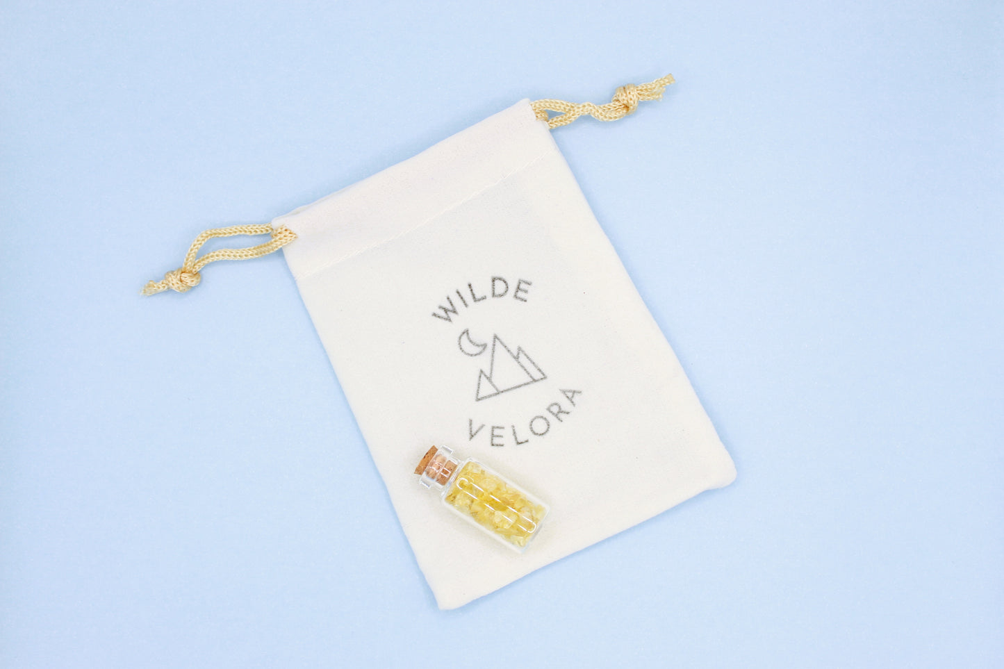 citrine crystals in glass jar and gift bag