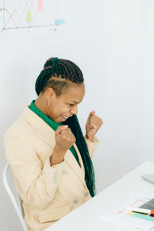 successful woman in business suit winning wealth and luck.