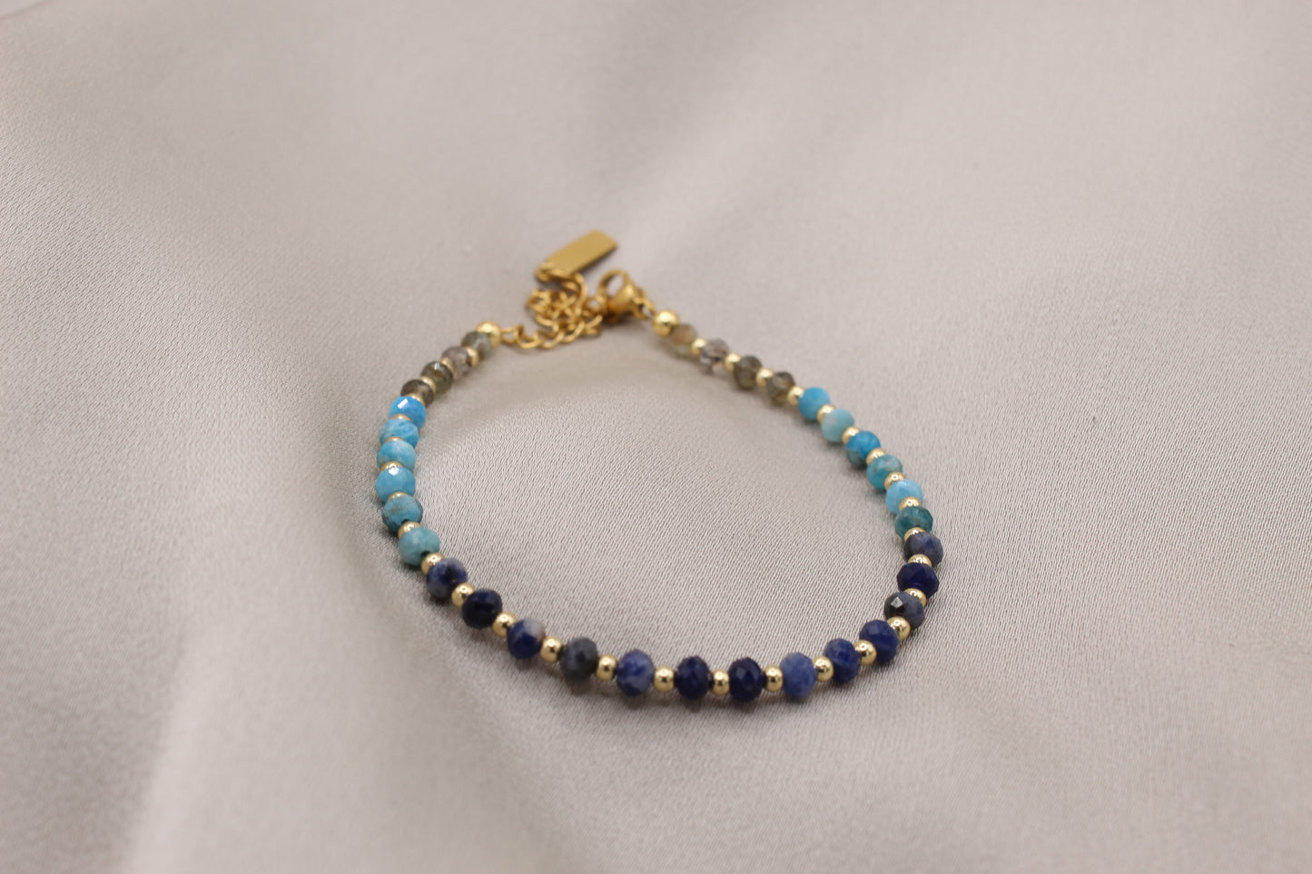 Faceted kyanite bracelet with gold clasp