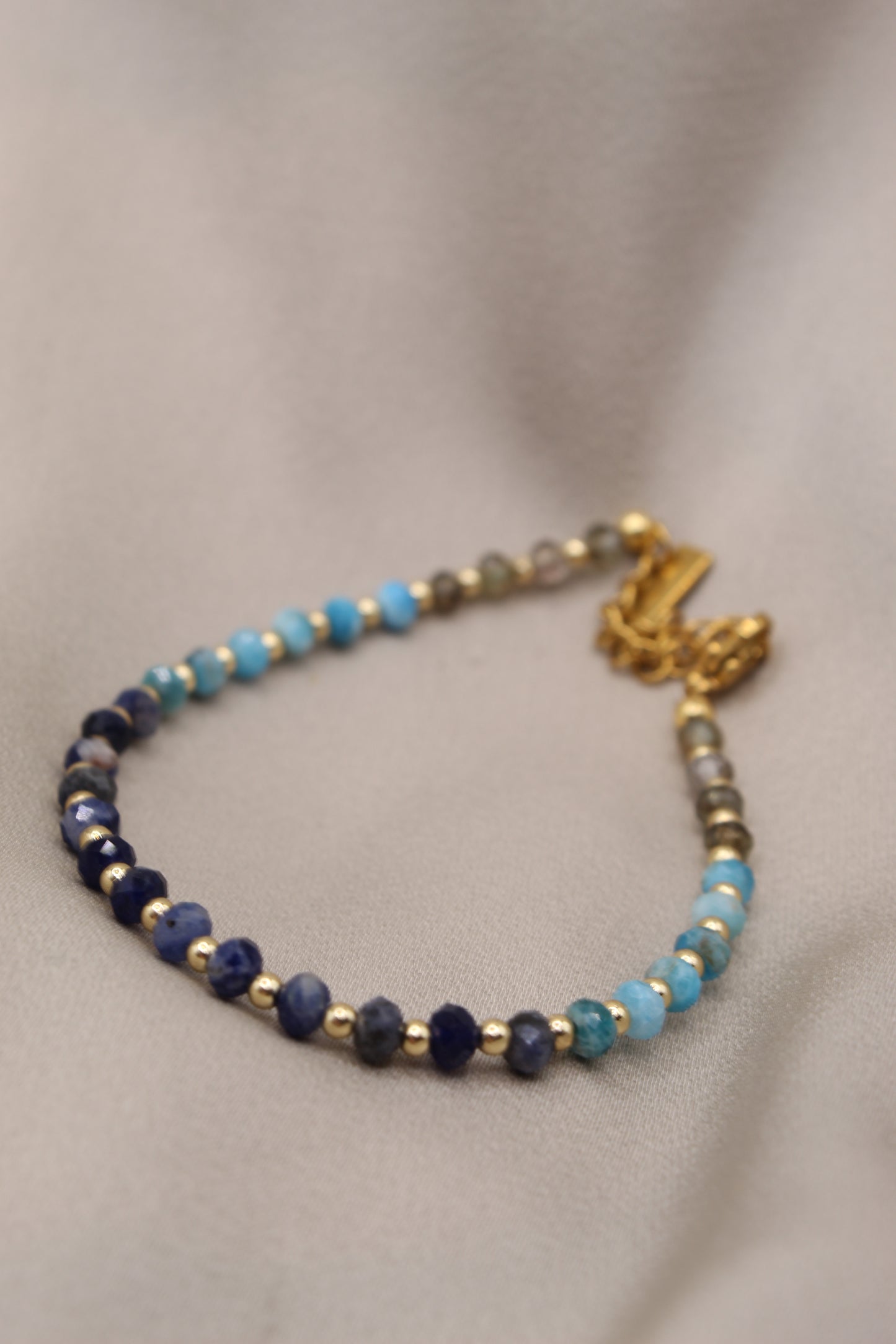 Faceted kyanite bracelet with gold clasp