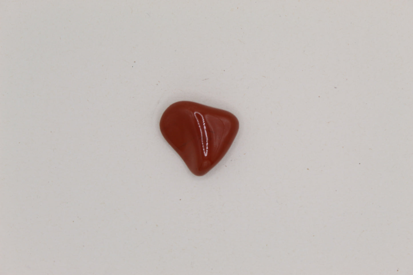 Red stone on a light gray background