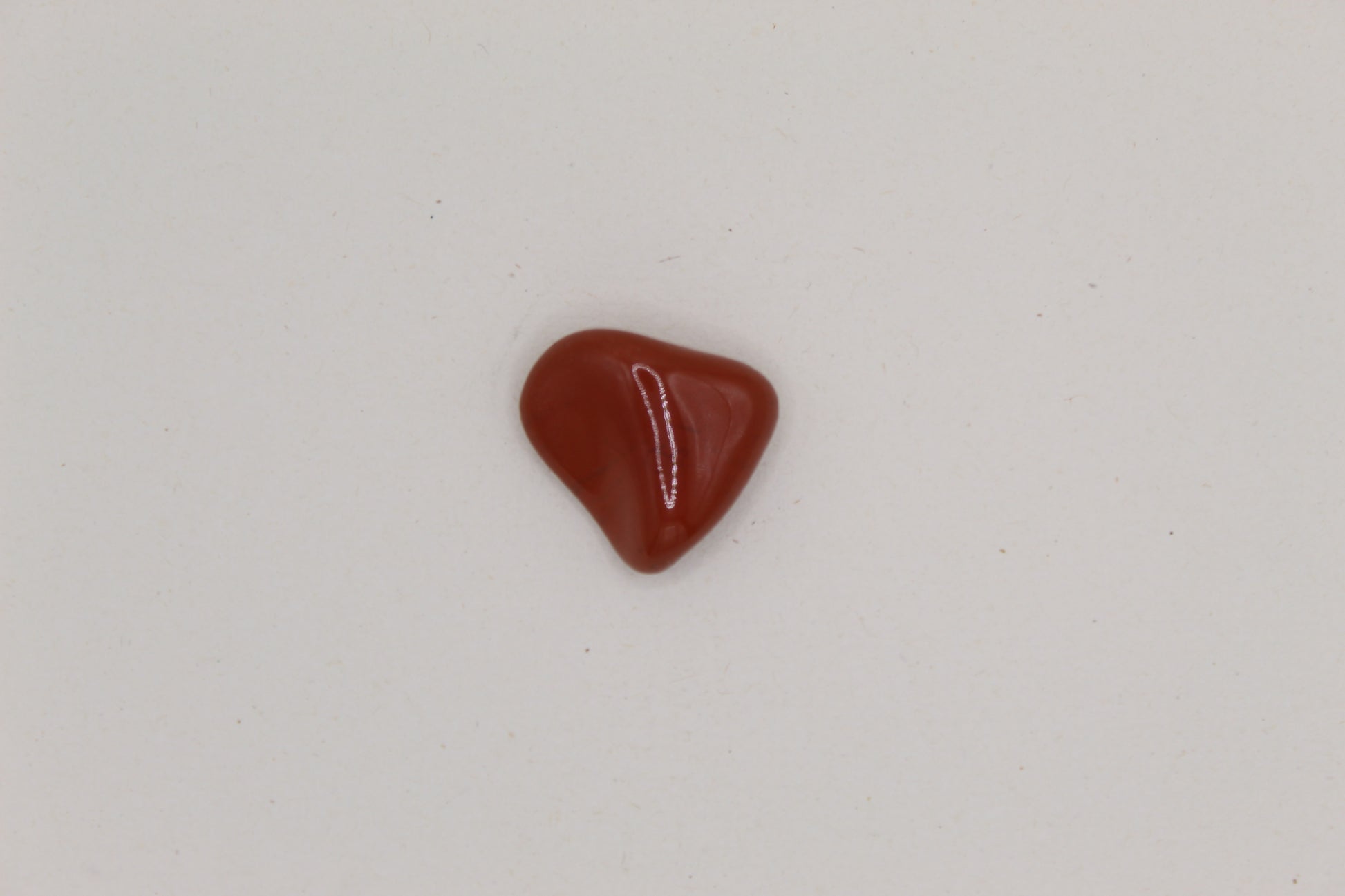 Red stone on a light gray background