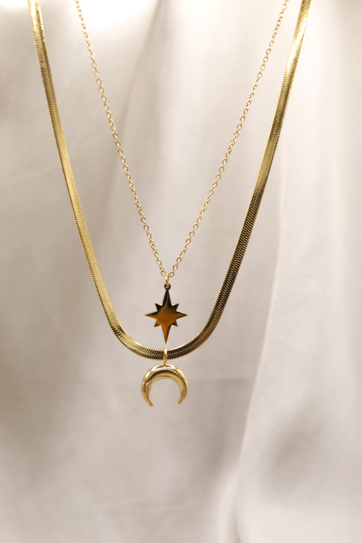 Gold double chain necklace with moon & star pendant