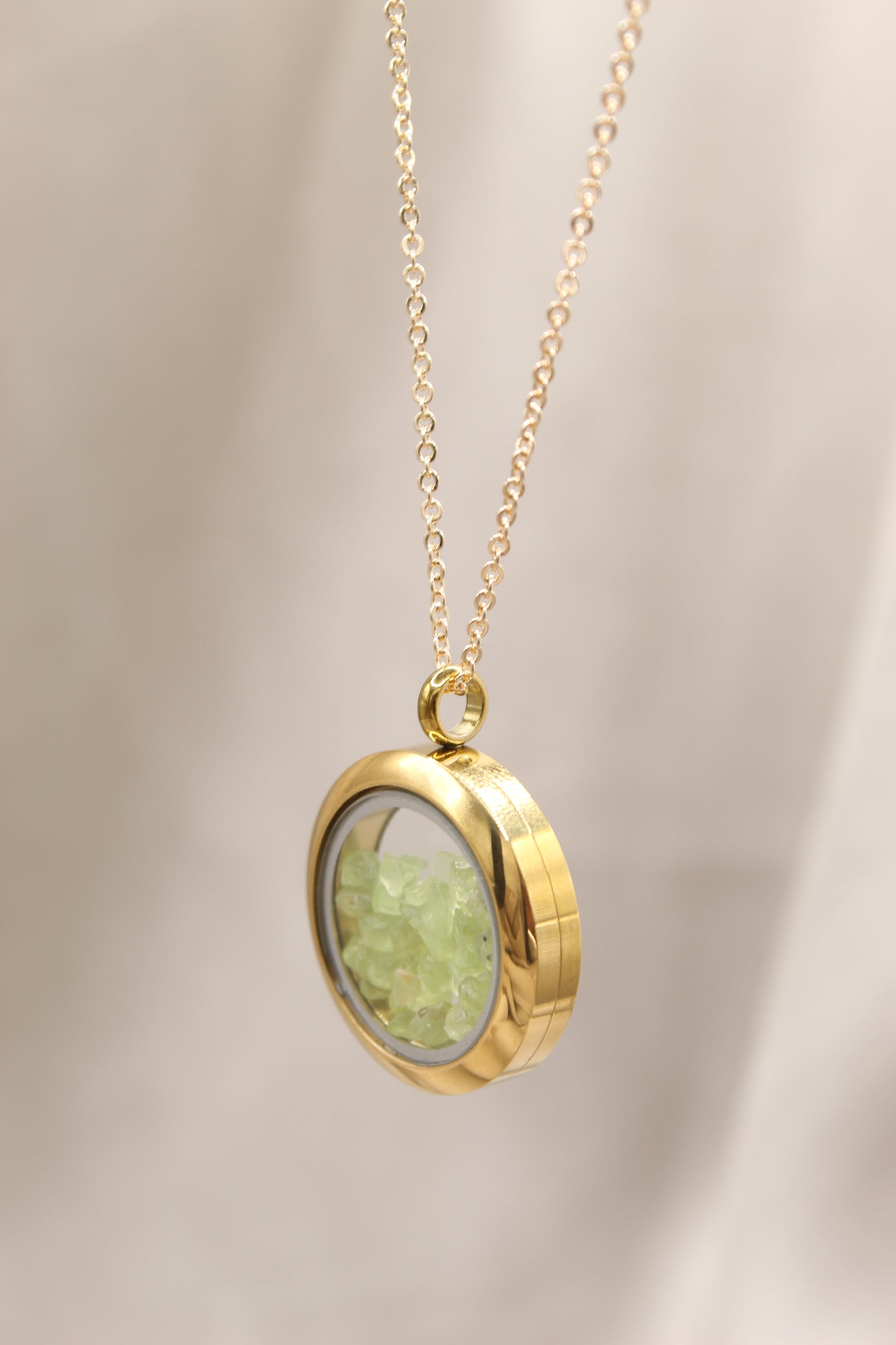 Peridot gold locket necklace