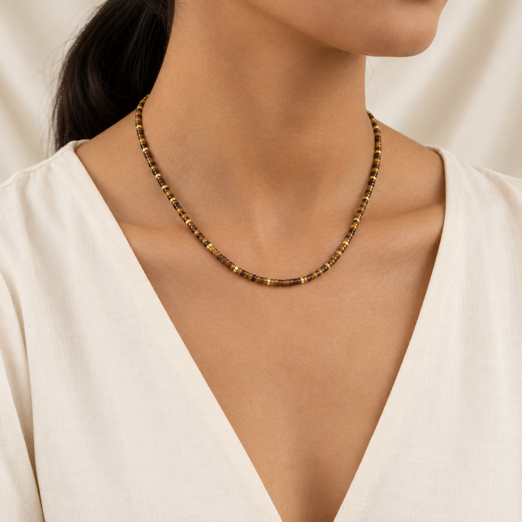 Tiger’s eye beaded necklace on a woman’s neck